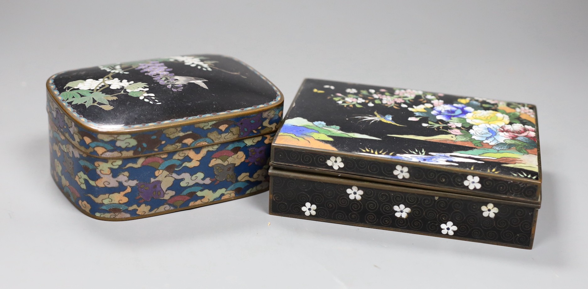 A Japanese silver wire cloisonné enamel box and cover, Meiji period and an early 20th century Japanese cloisonné enamel cigarette box, 13.5cms wide x 10cms deep